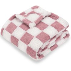 the pink and white checkered blanket is folded up