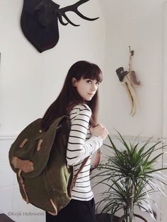 This genuine unused military backpack is made from sturdy heavy-duty canvas in army green shade. The leather shoulder straps are adjustable and wider on the shoulder for comfortable wearing. The bag is quite big and can hold a lot of your stuff in it, it also has a leather belt and a fabric pocket on one side where you can carry a big water bottle, a tripod, or a paper storage tube for example. It closes with a cord on the inside and fastens with a leather strap with a metallic buckle on the out Military Style Canvas Travel Bag, Military Style Green Backpack, Military Style Green Backpack For Outdoor, Military Style Green Outdoor Backpack, Military Style Khaki Bag For Adventure, Khaki Military Style Bag For Adventure, Military Style Backpack For Adventure, Army Rucksack, Army Backpack