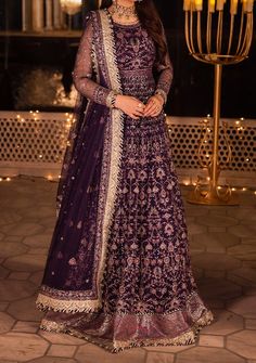 Introducing our New collection 'Chandni Raatein' by Asim Jofa designed to make you look and feel your best. Swathed in the mystique of twilight, this dress is a purple dream woven into existence. Champagne gold zari, like sunbeams kissing a lavender sky, are studded with stardust-like sequins. Threads in mauve and deep purple hues dance in harmony, creating a masterpiece of color. The embroidered dupatta, a wispy cloud of enchantment, finishes this ensemble with the grace of a fairytale ending. Embroidered Front and Back Bodice With Bodice Hem on Net Embroidered Kalis for Peshwas on Net Embroidered Border for Hemline of Peshwas on Net Embroidered Sleeves With Border on Net Embroidered Dupatta on Net With 4 Side Borders Color: There might be slight color variation due to lighting and flashe Velvet Anarkali, Net Anarkali, Batik Print Dress, Salwar Suits Party Wear, Indian Anarkali, Lehenga Jewellery, Side Borders, Saree Sale, Asim Jofa