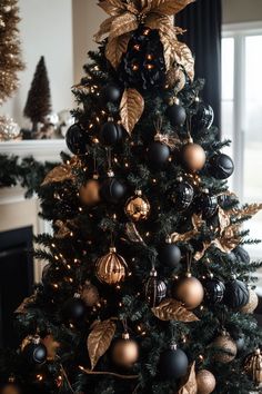 a christmas tree with gold and black ornaments