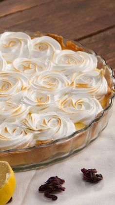 a lemon meringue pie on a wooden table