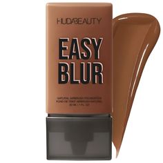 A lightweight, medium-to-buildable coverage foundation that’s non-comedogenic and ultra-blurring for an airbrushed finish.Highlighted Ingredients: - 1.5% Niacinamide: Smooths and refines the look of uneven texture and tone. - Silica: Pore-blurring, results in a natural airbrushed finish. Ingredient Callouts: It is vegan and cruelty-free.What Else You Need to Know: Huda has created the most lightweight, non-comedogenic, ultra-blurring foundation with medium-to-buildable coverage. Easy Blur is formulated with 1.5% skin smoothing niacinamide and pore-blurring silica for the most natural airbrushed finish. It is comfortable on the skin, blendable, and easy to apply. It’s available in a range of s Huda Foundation, Airbrush Foundation, Lightweight Foundation, Shea Butter Body Shop, Sephora Beauty, Makeup Sale, Textures And Tones, Too Faced Foundation, Skin Toner