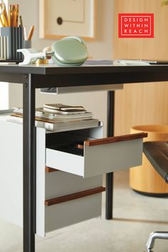 an office desk with drawers underneath it