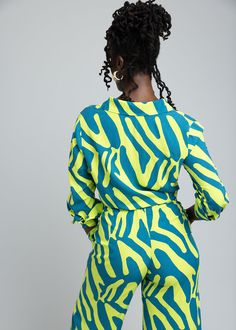 Style#2106LZA Embrace boldness in the Kwamena Women's African Print Button-Up in the dynamic Lime Zebra Abstract print. This breezy, non-stretch top is designed for those who love to stand out. Versatile and vibrant, this shirt is an essential piece to jazz up your summer style. Shop the matching items. *Disclaimer* Please refer to the fabric image for the true color of this product. Features: Long cuff with buttons on sleeve Rounded hem Vents at sides 100% Rayon for a light-weight breezy feel D Zebra Abstract, Stretch Top, Workout Accessories, Matching Items, African Print, Abstract Print, Sweater Jacket, Summer Style, Men Short Sleeve