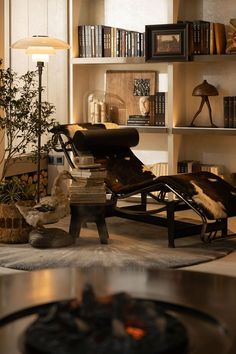 a living room filled with furniture and bookshelves