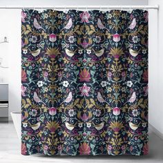 a shower curtain with birds and flowers on it