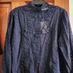 Doen Navy Blue Eyelet Blouse In 100% Cotton. This Blouse Has A Navy Blue Lace Mock Neck Collar, Lace Bodice Detail, Lace Trim On The 3/4" Length Sleeves, The Hem Is Surged So It Won't Fray, It Buttons All The Way Up The Back, And Has Such Pretty Little Buttons. I Really Like This Blouse. However, It Is Just A Little Too Short For My Age! Chic Blue Blouse With Lace Top, Chic Blue Lace Top Blouse, Blue Long Sleeve Blouse With Lace Top, Blue Long Sleeve Lace Top, Elegant Blue Blouse For Brunch, Eyelet Blouse, All The Way Up, Lace Bodice, Navy Blue Color