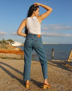 550 Levi's jeans in blue. High rise. Zipper fly. Front and back pockets. Straight leg. Available sizes: 29" waist EU 38-40 / UK 10-12 Actual measurements - 29"(74cm) waist - 38"(97cm) hips - 29"(74cm) inner leg - 10.5"(27cm). 30" waist EU 40 / UK 12 Actual measurements - 30"(76cm) waist - 38"(97cm) hips - 29.5"(75cm) inner leg - 11"(28cm). 31" waist EU 40-42 / UK 12-14 Actual measurements - 31"(79cm) waist - 38"(97cm) hips - 30"(76cm) inner leg - 11"(28cm). 32" waist EU 42 / UK 14 Actual measure Best Levis Jeans For Women, 550 Levis Jeans, Vintage Mom Jeans, Vintage Mom, Jumpsuit Skirt, Sleeveless Jacket, Lee Jeans, Womens Jeans, Jeans Womens