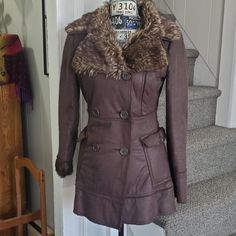 This Preloved Jacket Is In Like New Condition! I've Had This Since The Late 90's! If It Wasn't Too Small I'd Still Be Wearing It! It's Not Only Gorgeous, But It's Also Warm And Cozy! It's Has A Faux Suede Feel With Faux Fur Accents And Fully Lined With Faux Fur! It Features Button Flap Side Pockets And You Can Pop The Collar Up Or Down As Well As The Cuffs. It Buttons Down And Has Accent Buttons Along Side. Size Small Approximate Measurements: 16" Shoulders, 18" Armpits, 28" Length, 25" 22" Sleeve Length (When Folded) Brown Winter Outerwear With Faux Front Pockets, Brown Outerwear With Faux Front Pockets, Fitted Winter Outerwear With Faux Fur Lining, Fitted Outerwear With Faux Fur Lining For Winter, Fitted Outerwear With Faux Fur Lining For Fall, Fitted Winter Outerwear With Faux Front Pockets, Fitted Fall Outerwear With Faux Front Pockets, Fitted Brown Outerwear With Padded Collar, Cold Weather Pea Coat With Faux Fur Trim