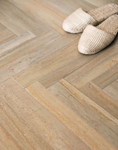 a pair of shoes sitting on top of a wooden floor