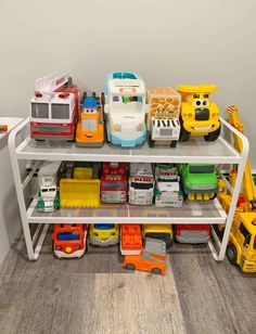 toy cars and trucks are stacked on top of each other in this playroom area