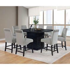 a dining room table with chairs around it