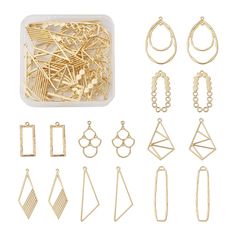 a bunch of different types of earrings and necklaces in a plastic container on a white background