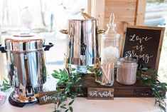 a table topped with pots and pans filled with food