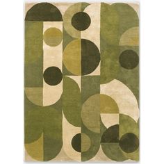 an area rug with various shapes and colors on the floor, including circles in green