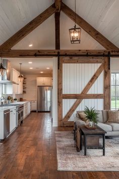 Rustic-modern barndominium featuring shiplap walls, sliding barn door, and large windows for natural light Smart Home Technology