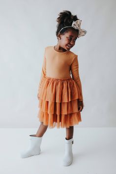 This Pumpkin Rib Dream Tutu DressÂ for girls will make your little one feel like the belle of the fall ball! Bamboo material offers comfort and breathability while the cute and fun tutu design is perfect for twirling around in. Let your little princess show off her pumpkin style all season long! Made from theÂ softest and most breathable seasonal bamboo viscose material,Â your babe won't want to take this off! Designed for extra play and all the sass with our ruffle detail to celebrate in style! Tutu Design, Pageant Shoes, Fall Ball, Tuxedo Accessories, Toddler Flower Girls, Girls Dress Outfits, Toddler Flower Girl Dresses, Infant Flower Girl Dress