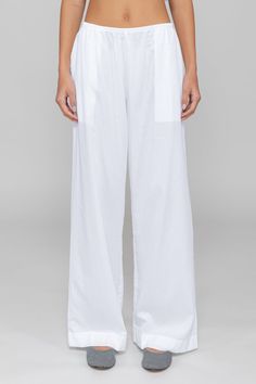 Breeze into summer. Our bestselling Yoko Pocket Pant returns: Cut in 100%, crisp cotton lawn, this wear-anywhere pant features a comfortable elasticized waistband, side seam pockets, the perfect relaxed fit. White Relaxed Wide Leg Pants With Elastic Waistband, White Pants With Elastic Waistband, White Pants With Elastic Waistband And Straight Hem, Relaxed White Bottoms With Pockets, Relaxed White Wide-leg Bottoms, Relaxed White Wide Leg Bottoms, Cotton Wide-leg Pants With Elastic Side Panels, White Relaxed Straight Pants, Relaxed White Wide-leg Pants