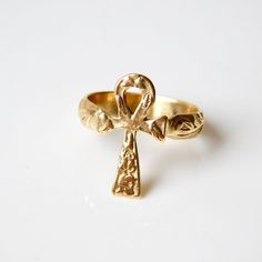 This 18k solid Gold antique detailed Ankh cross ring is reminiscent adorned treasure. Can be custom ordered in 18k or 14k white rose or yellow gold. The Ankh, Signified wisdom and insight on the highest level, symbolizing the divine bestowal of eternal life. Widely used as an amulet in Ancient Egypt. From the spiritual point of view the ankh represented the key to all hidden knowledge. Sizing included Custom orders welcomed! Free worldwide shipping To see more.... To more necklaces and pendants: Spiritual 14k Gold Cross Jewelry, Spiritual Yellow Gold Promise Ring Jewelry, Gold Cross Rings With Spiritual Style, Symbolic Ceremonial Ring, Spiritual 14k Yellow Gold Rings, Spiritual Yellow Gold Engraved Promise Ring, Spiritual Engraved Yellow Gold Promise Ring, Yellow Gold Cross Rings For Wedding, Spiritual Gold-plated Yellow Gold Rings