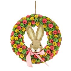 a christmas ornament with a bunny in the center and colorful flowers around it