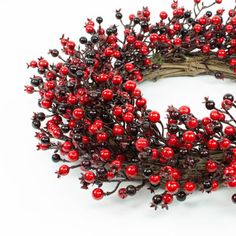 a wreath with berries and twigs on it