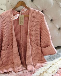 We love this cozy sweater. The absolute softest pink nubby knit pairs with an open front, slouchy cuffed cropped sleeves & cozy front pockets. Slouchy fit. Perfect cozying up by the fire. Color: Pink Poly Hand wash cold Small Medium Large Bust 36 38 40 Waist 36 38 40 Hips 39 40 42 Length 27 27 27 Bust, waist, and hip measurements are a total circumference. Length is measured from the top of the sweater to the hem. Measurements are an estimate. Cozy Textured Knit Cropped Sweater For Loungewear, Cozy Textured Knit Cropped Sweater With Relaxed Fit, Cozy Cropped Sweater For Spring With Soft Texture, Spring Cozy Cropped Sweater With Soft Texture, Comfortable Chunky Knit Sweater For Loungewear, Pink Cozy Cropped Sweater For Spring, Cozy Pink Cropped Sweater For Spring, Cozy Pink Cropped Sweater For Winter, Cozy Pink Cropped Sweater For Fall