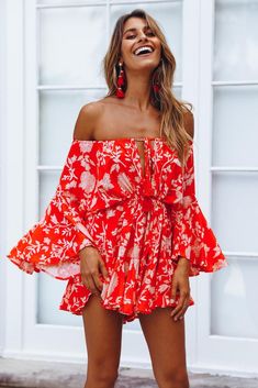 Length from shoulder to hem 58cm. Red playsuit. Not lined. Cold hand wash only. Model is a standard XS and is wearing XS. True to size. Non stretchy fabric. No zipper, slip on style. Print placement may vary. Rayon. Slip into our Made In The Aftermath Playsuit after a long day of lounging poolside or sun baking at the beach! This oversized style has a tie up neckline and waist, wide sleeves and it has a frill hem. We love wearing ours with pool slides and saltwater drenched hair. Red Jumpsuits And Rompers For Spring Beach Outings, Red Jumpsuits And Rompers For Beach In Spring, Red Long Sleeve Jumpsuits And Rompers For Summer, Red Long Sleeve Jumpsuits For Summer, Red Summer Jumpsuits And Rompers For Beach, Red Fitted Jumpsuits And Rompers For Vacation, Red Jumpsuits And Rompers For Summer Day Out, Red Summer Beach Jumpsuits And Rompers, Casual Red Jumpsuits And Rompers With Ruffles