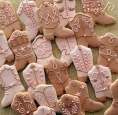 decorated cookies are arranged on a table