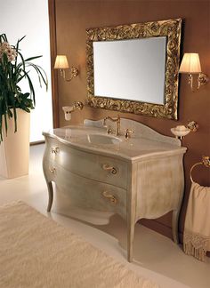 a bathroom with a vanity, mirror and flowers in vases on the counter top