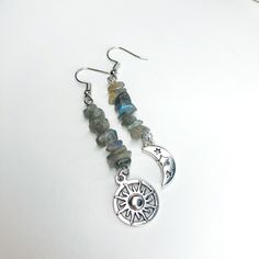 Labradorite Crystal Celestial Drop Earrings/Silver Sun and Moon Drop Earrings/Hippie Earrings/Moon Hippy Earrings/Hippie Jewelry/Boho Gift - Silver Plated Crystal Earrings - Crystal: Labradorite  - Charm Material: Silver plated brass  - Closure: Hook or Huggie Check other styles in my shop: https://www.etsy.com/listing/1457441539/prehnite-crystal-green-sun-silver-drop?click_key=2c98c4d7ef1c600e346e0d454bddbe96c2be70dd%3A1457441539&click_sum=bfd25b43&ref=shop_home_feat_1&pro=1 https://www.etsy.co Hippie Silver Dangle Jewelry, Silver Hippie Dangle Jewelry, Silver Moon Earrings For Festivals, Bohemian Jewelry With Moon Charm And Labradorite, Bohemian Labradorite Jewelry With Moon Charm, Bohemian Moon Phase Dangle Earrings, Bohemian Moon Phase Drop Earrings, Silver Spiritual Moon Phase Earrings, Bohemian Dangle Earrings With Sun And Moon Design