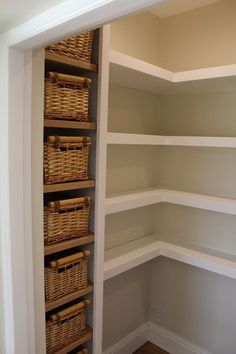 empty shelves with wicker baskets in the corner