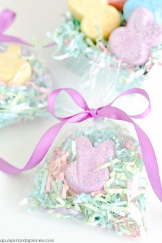 two bags filled with heart shaped cookies and sprinkles on top of each other