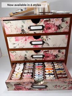 an old dresser with many drawers filled with paint