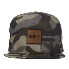 a camo hat with a leather patch on the front and brown logo on the side