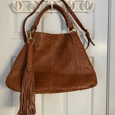 G.I.L.I. Authentic Large Leather Ostrich Print Bag With Strap And Tassel. Butter Soft Leather. Nwot Includes Dust Bag, Adjustable Strap, Bottom Studs, Detachable Strap, Lined, Double Handles. Cognac Leather Bag, It Bags, Tan Body, Ostrich Leather, Large Shoulder Bags, Hanging Bag, Printed Bags, Leather Tote Bag, Leather Handbag