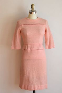 "Vintage 1950s wiggle daydress. Petal pink woven wool. Line detail on bodice and by hips. Three quarter sleeves, darted bust and nipped waist. Straight skirt with back metal zipper closure. State of garment | very good, small stain on the inner lining of the collar. Measurements ✂--- best fit | extra small bust | 33- snug 34\" shoulders | 14\" shoulder to waist | 15\" sleeves | 14 \" waist | 25\" hips | up to 32-33\" total length (shoulder to hem) | 36\" tag | union made tag ★★Visit The Shop★★ h 1950s Style Fitted Daywear Dresses, Pink Retro Dress For Work, Retro Pink Dress For Work, Vintage Pink Dress For Work, Powder Dress, Pink Fitted Dress, Hip Ups, Wiggle Dress, Straight Skirt