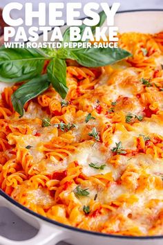 cheesy pasta bake with roasted pepper sauce in a white casserole dish