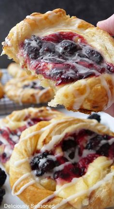 A blackberry pastry on a white plate with a pastry with a bite taken out of it. Cherry Pastry Recipes, Cherry Pastry, Homemade Cherry Sauce, Blackberry Cream Cheese, Blackberry Filling, Cream Cheese Puffs, Puff Pastry Recipes Dessert, Cream Cheese Puff Pastry, Blackberry Dessert