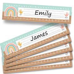 four personalized name tags with rainbows on them