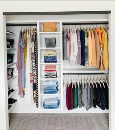 an organized closet with clothes and shoes