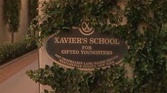 a sign on the side of a building that says xavers school for gifted youngsters