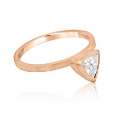 a rose gold ring with a diamond in the middle and a small triangle on top