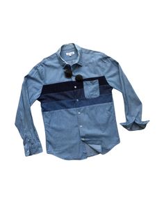 "Description: Used and pre-owned authentic vintage denim shirts, long sleeves, patched pockets, featuring patchwork of three different fabrics and color shade as seen. Once those three shades were combined to each other, it came out such a cool, vintage, trendy, and unique patchwork denim shirts as pictures shown. There's only one unique item you can find here to wear on every occasion, especially for your casual outfit. See measurements below. If it fits you, please don't miss it! Features:  - Vintage patchwork mixture of denim and cotton shirts. - Perfect combination of different color shades. - Patched pocket. - Unique design. Size: L (on tag) - Length (centre of back neckline to bottom): 28.5 - 29\" - Armpit to armpit: 40 - 41\" - Shoulder to shoulder: 17.5\" - Sloped Sleeves (Above sh Blue Long Sleeve Shirt With Patch Pockets, Blue Denim Shirt With Patch Pockets, Blue Shirt With Patch Pockets For Spring, Blue Spring Shirt With Patch Pockets, Spring Blue Shirt With Patch Pockets, Long Sleeve Cotton Shirt With Patchwork, Cotton Long Sleeve Shirt With Patchwork, Blue Long Sleeve Top With Patch Pockets, Cotton Long Sleeve Shirt With Patches