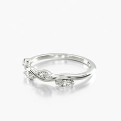 a white gold ring with three diamonds on it