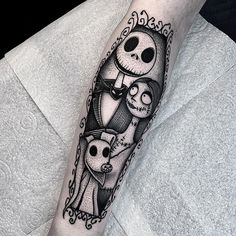 a person with a tattoo on their arm that has a cartoon character in the frame