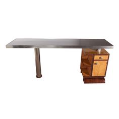 a desk with drawers and a metal top