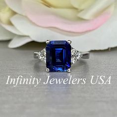 Emerald Cut Engagement Ring / Blue Sapphire Wedding Ring / Sapphire and Moissanite Ring / 14k White Gold / #6312 #LadiesRing #EverydayRing #ProposalRing #WeddingRing #GiftIdeasForHer #AnniversaryGift #PromiseRing #EngagementRing #BridalGift #BirthdayGift Radiant Cut Blue Emerald Jewelry, Blue Radiant Cut Emerald Jewelry, Emerald Ring With Sapphire Accent Stones, Emerald Sapphire Ring With Accent Stones, Gia Certified Princess Cut Sapphire Ring Gift, Gia Certified Radiant Cut Sapphire Ring Gift, Emerald Cut Sapphire Solitaire Jewelry, Sapphire Emerald Cut Diamond Promise Ring, Fine Jewelry Emerald Cut Diamond Ring With Lab-created Sapphire