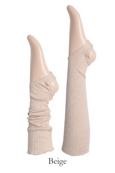 Introducing the MOMO Leg Warmer - a versatile and stylish accessory that's ready to add a touch of charm to your outfit. Crafted from a soft, ribbed blend of cotton and modal, these leg warmers offer both comfort and style. The ruffle finishing hem with vertical punching lines adds a delightful texture and detail.Designed to be wearable all year round. Wear them knee-high with a leotard or leggings for a classic look. For a trendy twist, try the ruched style with loose socks paired with shorts o Trendy Fitted Solid Leg Warmers, Trendy Fitted Solid Color Leg Warmers, Solid Ribbed Stretch Leg Warmers, Solid Stretch Ribbed Leg Warmers, Casual Fitted Ribbed Legwear, Comfortable Cotton Stretch Leg Warmers, Solid Cotton Stretch Leg Warmers, Soft Cotton Leg Warmers For Fall, Solid Stretch Cotton Leg Warmers