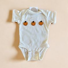 The cutest pumpkin baby outfit for this fall season! Makes the perfect outfit for fall baby photos, pumpkin patch and more. Available for the whole family also!  Please be mindful that we do not accept RETURNS / EXCHANGE / ORDER CANCELLATIONS in any way because this is made to order. We are also open for wholesale/bulk orders, kindly send us a message! Handmade in Chicago. Support small businesses. Shop small. ♡ Cotton Onesie For Playtime In Fall, Playful Cotton Onesie For Fall, Playful Fall Cotton Onesie, White Cotton Onesie For Fall, Cute White Onesie For Fall, Fitted White Onesie For Fall, Baby Pumpkin Patch Outfit, Baby Pumpkin Patch, Baby Pumpkin Outfit