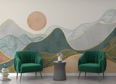 two green chairs sitting next to each other in front of a wall with mountains on it